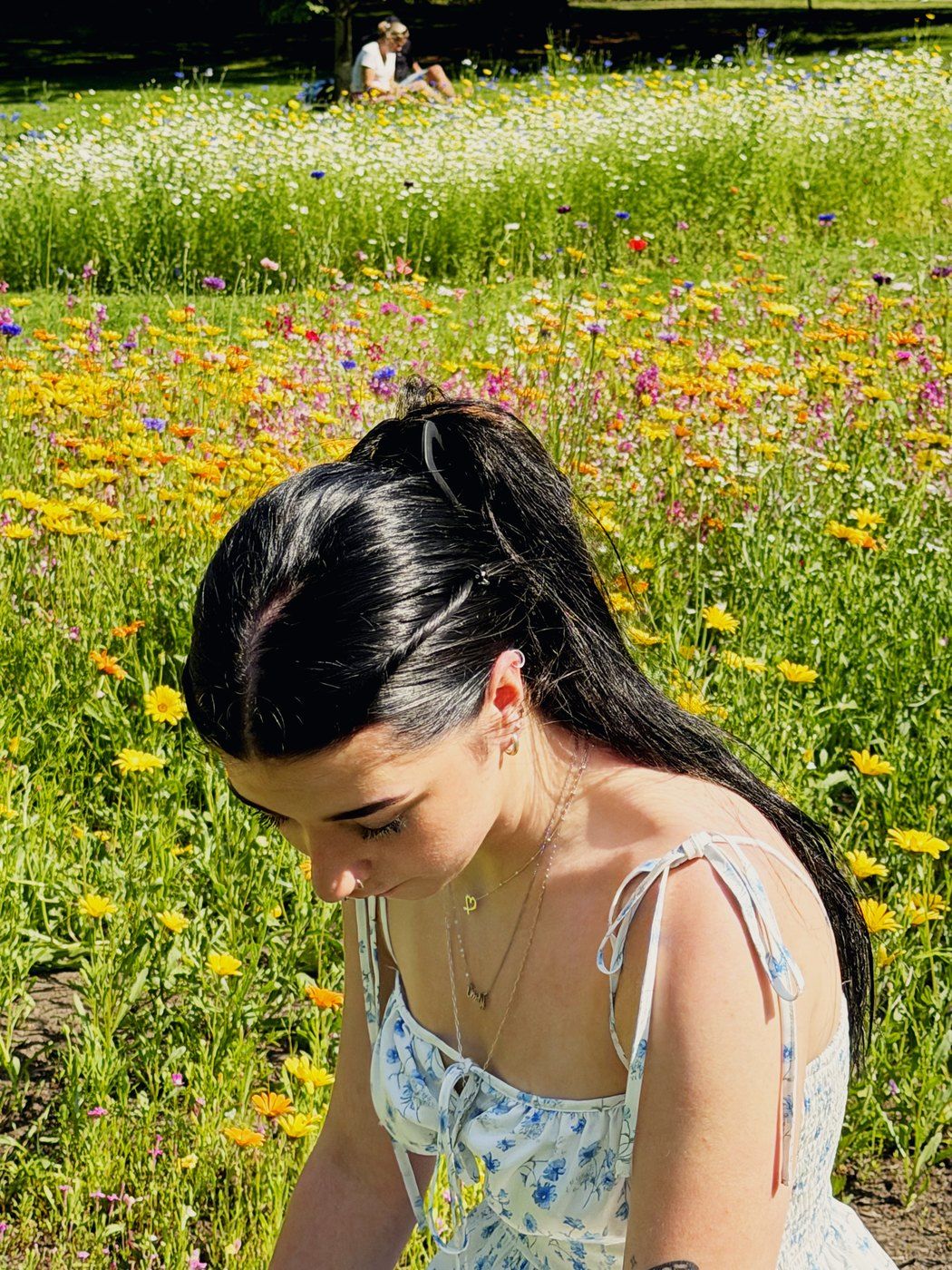 Emmy Bloom among summer wildflowers